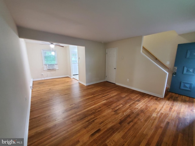 117 S Shenandoah Ave, Front Royal, VA 22630 - unfurnished living room featuring wood finished floors, baseboards, and ceiling fan