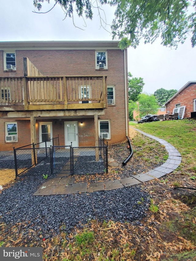 117 S Shenandoah Ave, Front Royal, VA 22630 - rear view of property with a gate, fence, brick siding, and a deck