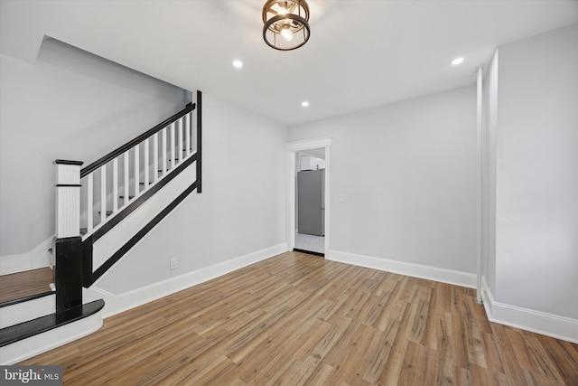 329 Euclid Ave, Trenton, NJ 08609 - unfurnished living room featuring stairs, wood finished floors, baseboards, and recessed lighting