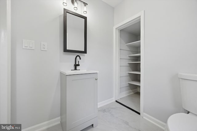 329 Euclid Ave, Trenton, NJ 08609 - bathroom with toilet, vanity, and baseboards