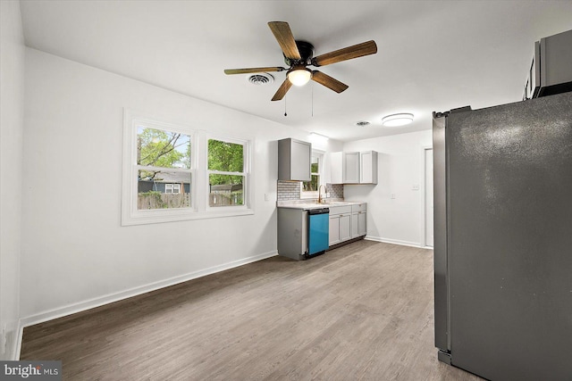 104 Louise Ave, Salisbury, MD 21804 - kitchen featuring freestanding refrigerator, light wood-style floors, a ceiling fan, baseboards, and light countertops