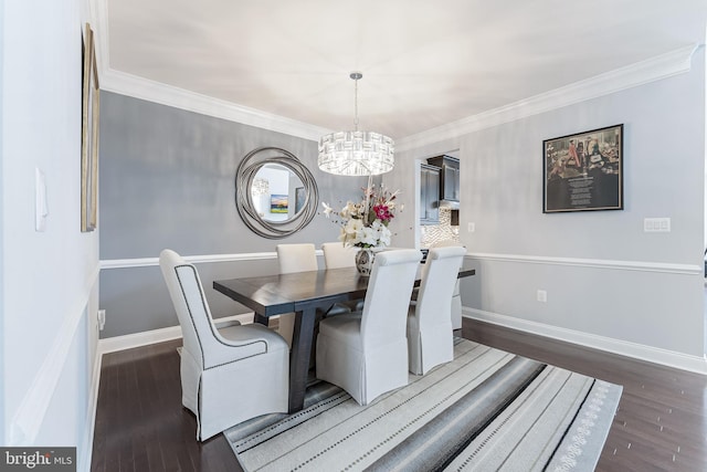 23412 Longollen Woods Ter, Ashburn, VA 20148 - dining room featuring wood finished floors, a chandelier, crown molding, and baseboards