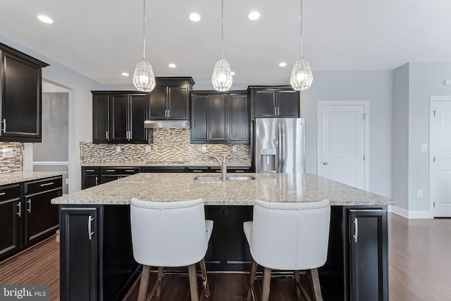23412 Longollen Woods Ter, Ashburn, VA 20148 - kitchen featuring stainless steel refrigerator with ice dispenser, a sink, dark wood-type flooring, decorative backsplash, and recessed lighting