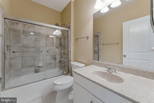 23412 Longollen Woods Ter, Ashburn, VA 20148 - full bathroom featuring tile patterned flooring, vanity, toilet, and combined bath / shower with glass door