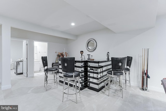 23412 Longollen Woods Ter, Ashburn, VA 20148 - dining space with wet bar, baseboards, and recessed lighting