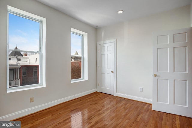 15 Todd Pl NE, Washington, DC 20002 - unfurnished bedroom with hardwood / wood-style flooring, baseboards, and recessed lighting