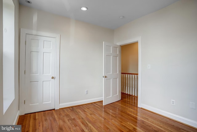15 Todd Pl NE, Washington, DC 20002 - unfurnished bedroom with light wood-type flooring, baseboards, and recessed lighting