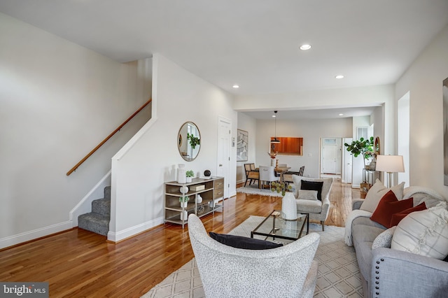 15 Todd Pl NE, Washington, DC 20002 - living room featuring light wood-style floors, stairs, recessed lighting, and baseboards