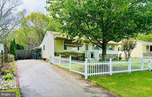 view of front of home featuring asphalt driveway