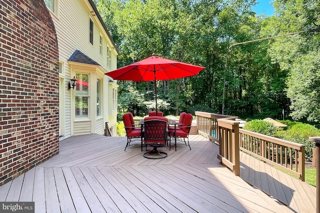 7808 Devereux Manor Ct, Fairfax Station, VA 22039 - wooden terrace featuring outdoor dining area and view of wooded area