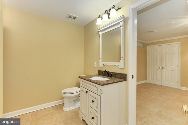 7808 Devereux Manor Ct, Fairfax Station, VA 22039 - bathroom featuring tile patterned flooring, vanity, toilet, crown molding, and baseboards