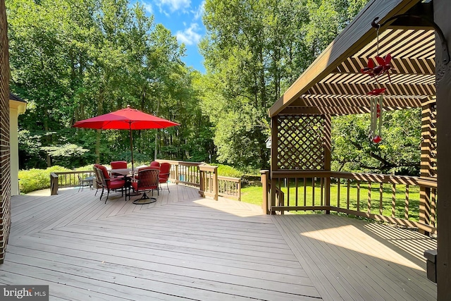 7808 Devereux Manor Ct, Fairfax Station, VA 22039 - deck with a pergola, outdoor dining space, and view of wooded area