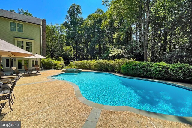7808 Devereux Manor Ct, Fairfax Station, VA 22039 - view of swimming pool featuring a patio, a pool with connected hot tub, and french doors