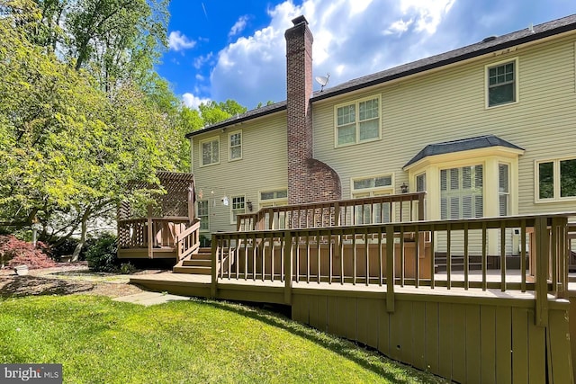 7808 Devereux Manor Ct, Fairfax Station, VA 22039 - rear view of property featuring a wooden deck, a chimney, and a lawn