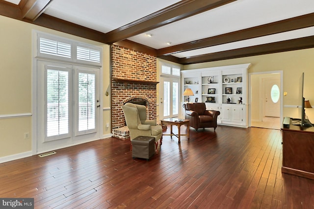 7808 Devereux Manor Ct, Fairfax Station, VA 22039 - sitting room featuring beamed ceiling, dark wood-type flooring, plenty of natural light, a brick fireplace, and baseboards