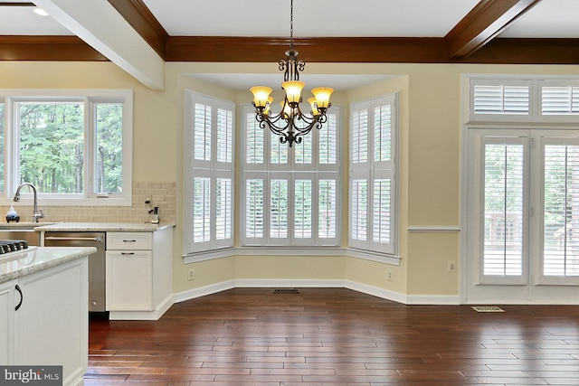 7808 Devereux Manor Ct, Fairfax Station, VA 22039 - kitchen featuring stainless steel dishwasher, healthy amount of natural light, a chandelier, dark wood-type flooring, and crown molding