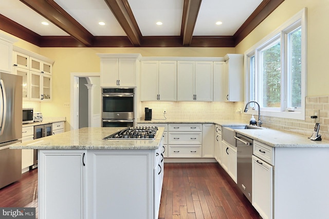 7808 Devereux Manor Ct, Fairfax Station, VA 22039 - kitchen featuring stainless steel appliances, a center island, beam ceiling, a sink, and beverage cooler
