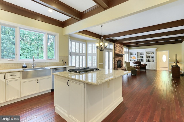 7808 Devereux Manor Ct, Fairfax Station, VA 22039 - kitchen featuring a sink, open floor plan, beamed ceiling, stainless steel appliances, and dark wood-type flooring