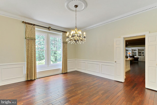 7808 Devereux Manor Ct, Fairfax Station, VA 22039 - empty room with a chandelier, a decorative wall, dark wood-style floors, crown molding, and a wainscoted wall