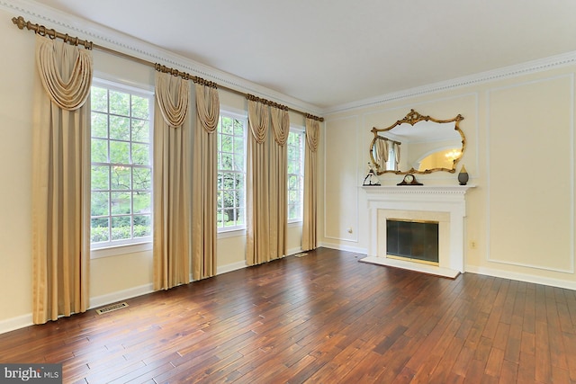 7808 Devereux Manor Ct, Fairfax Station, VA 22039 - unfurnished living room with dark wood-style floors, a glass covered fireplace, plenty of natural light, crown molding, and baseboards