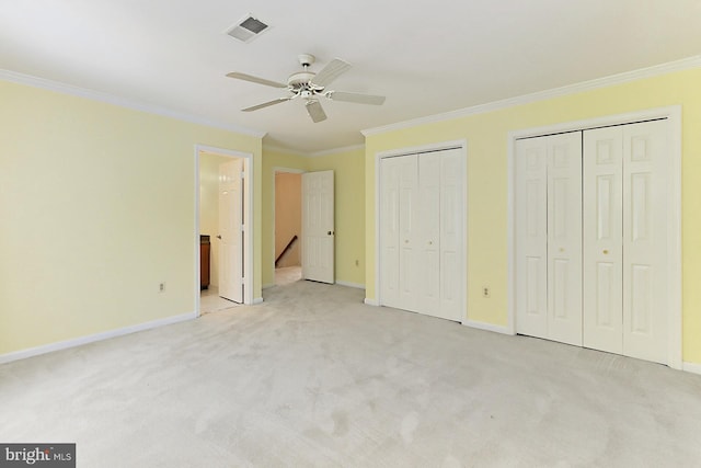 7808 Devereux Manor Ct, Fairfax Station, VA 22039 - unfurnished bedroom with ornamental molding, light colored carpet, multiple closets, baseboards, and ensuite bath