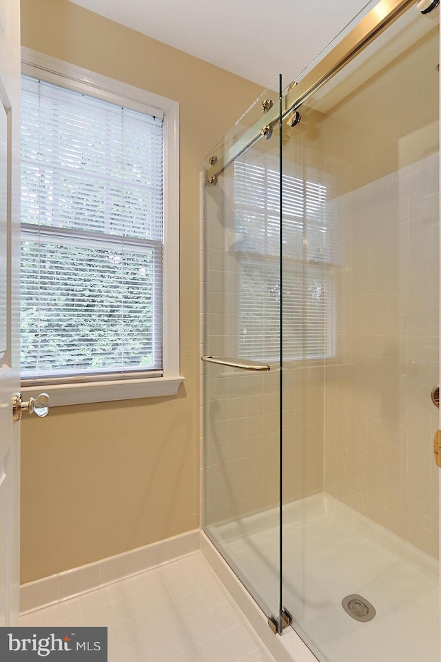 7808 Devereux Manor Ct, Fairfax Station, VA 22039 - bathroom featuring a stall shower, tile patterned flooring, and baseboards