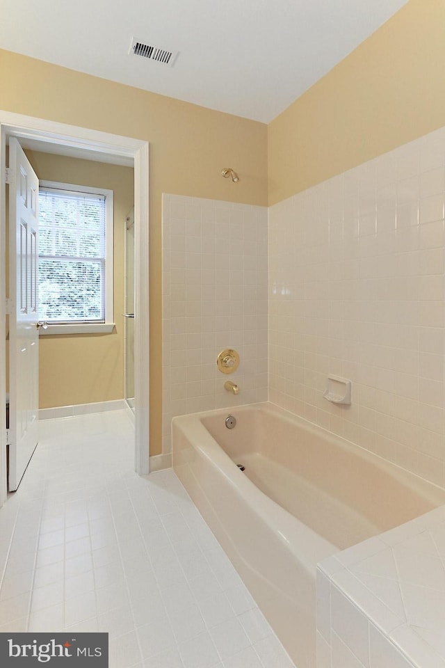 7808 Devereux Manor Ct, Fairfax Station, VA 22039 - bathroom featuring a shower, a bath, and tile patterned floors