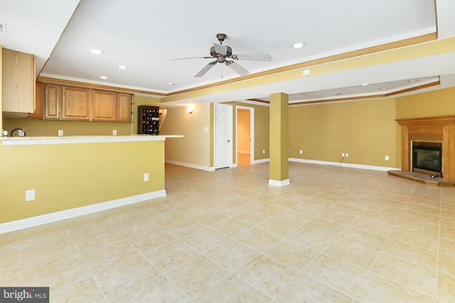 7808 Devereux Manor Ct, Fairfax Station, VA 22039 - unfurnished living room featuring recessed lighting, ceiling fan, light tile patterned floors, a tray ceiling, and ornamental molding