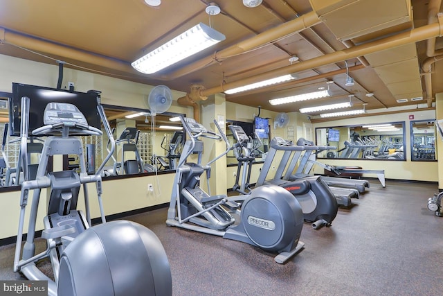 exercise room with baseboards