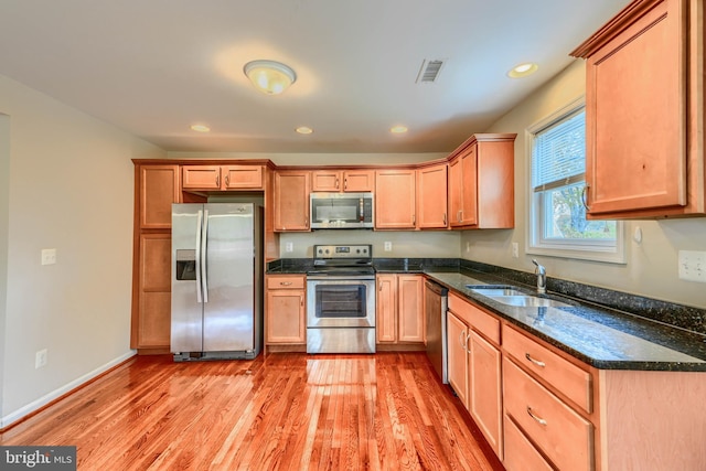 806 Frailey Rd, Emmitsburg, MD 21727 - kitchen with appliances with stainless steel finishes, light wood-style flooring, a sink, dark stone countertops, and recessed lighting