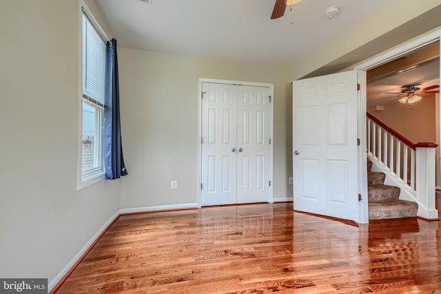 806 Frailey Rd, Emmitsburg, MD 21727 - unfurnished bedroom featuring wood finished floors, baseboards, a closet, and a ceiling fan