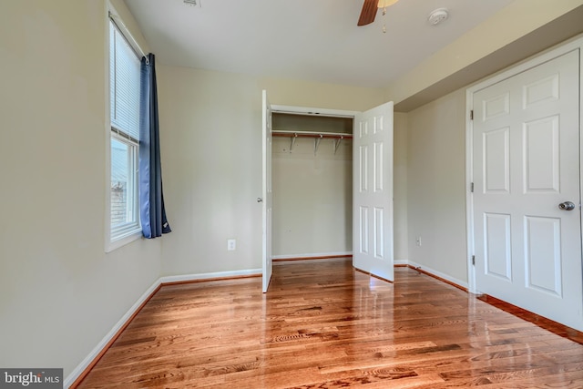 806 Frailey Rd, Emmitsburg, MD 21727 - unfurnished bedroom with wood finished floors, baseboards, a closet, and ceiling fan