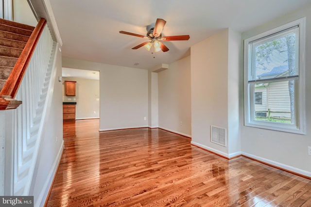 806 Frailey Rd, Emmitsburg, MD 21727 - unfurnished room featuring light wood finished floors, a ceiling fan, baseboards, and stairway
