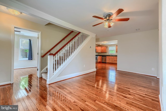 806 Frailey Rd, Emmitsburg, MD 21727 - unfurnished living room featuring light wood-style flooring, stairway, ceiling fan, and plenty of natural light