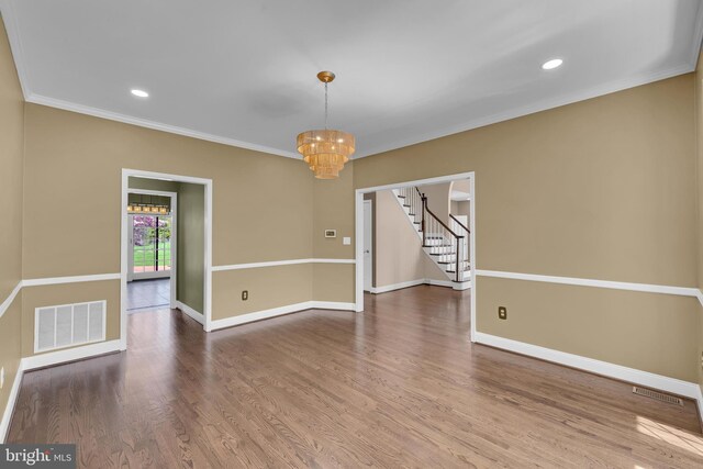 4 Stults Dr, Plainsboro, NJ 08536 - empty room with a chandelier, ornamental molding, wood finished floors, stairs, and baseboards