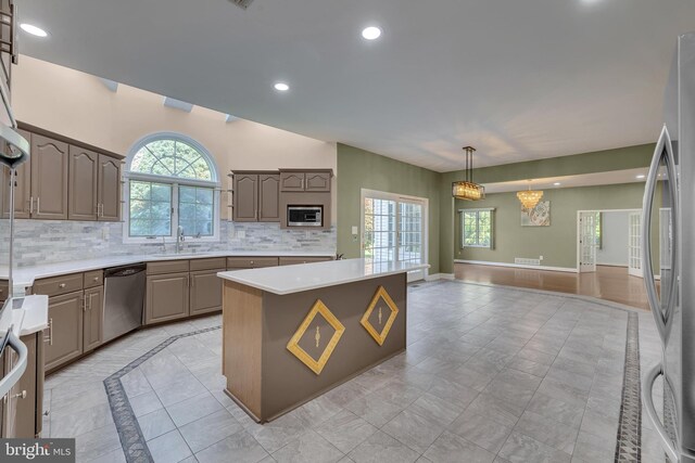 4 Stults Dr, Plainsboro, NJ 08536 - kitchen with appliances with stainless steel finishes, decorative backsplash, open floor plan, a center island, and recessed lighting
