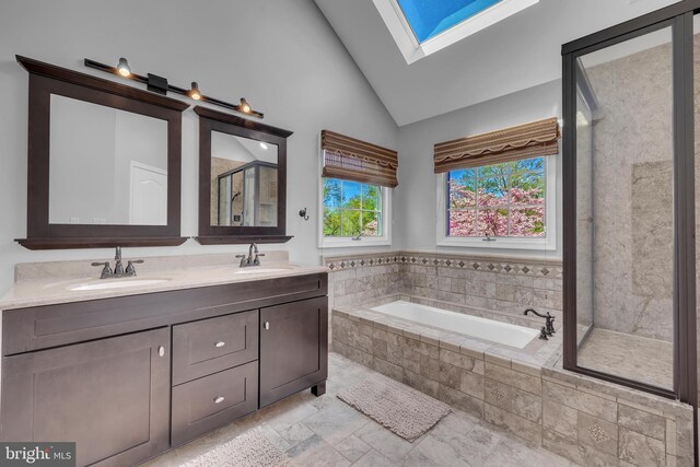 4 Stults Dr, Plainsboro, NJ 08536 - bathroom featuring a skylight, a stall shower, a garden tub, double vanity, and high vaulted ceiling
