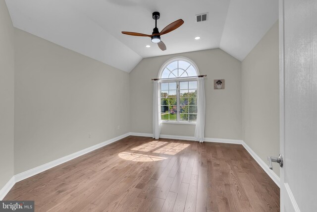 4 Stults Dr, Plainsboro, NJ 08536 - spare room with a ceiling fan, wood finished floors, vaulted ceiling, and baseboards