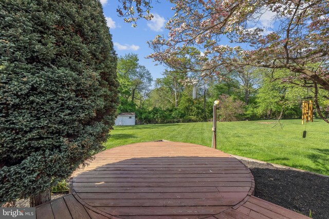 4 Stults Dr, Plainsboro, NJ 08536 - wooden deck featuring a shed, an outdoor structure, and a lawn