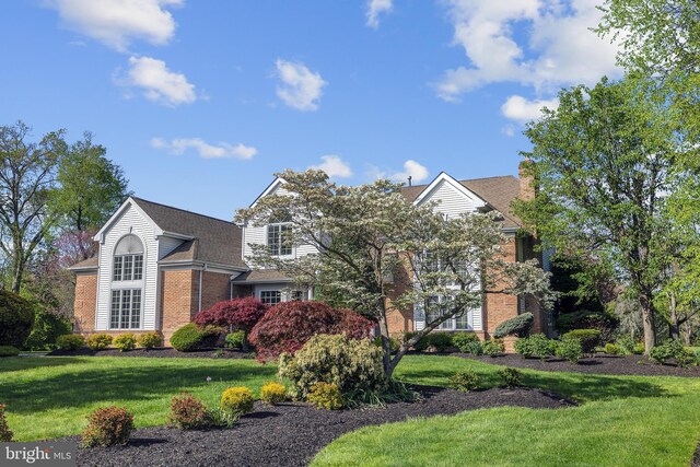 4 Stults Dr, Plainsboro, NJ 08536 - view of front of property featuring brick siding, a front yard, and roof with shingles