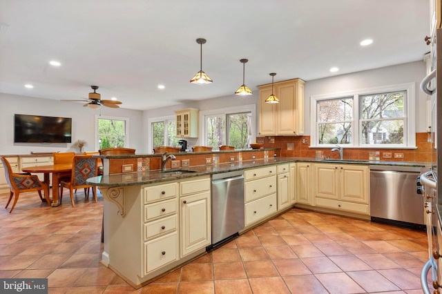 902 Emerald Dr, Alexandria, VA 22308 - kitchen featuring cream cabinetry, stainless steel dishwasher, a sink, and recessed lighting