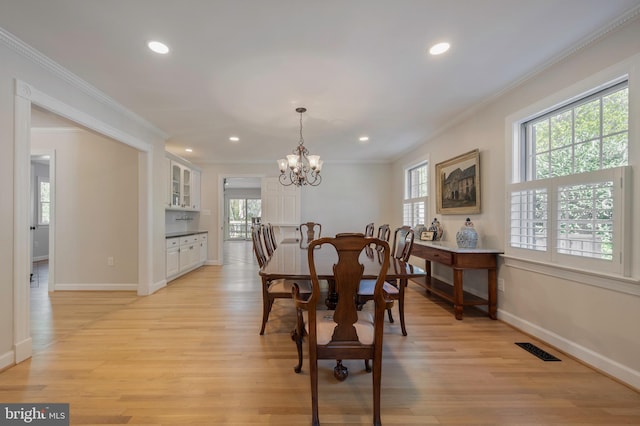 902 Emerald Dr, Alexandria, VA 22308 - dining space with ornamental molding, a chandelier, baseboards, recessed lighting, and light wood-type flooring