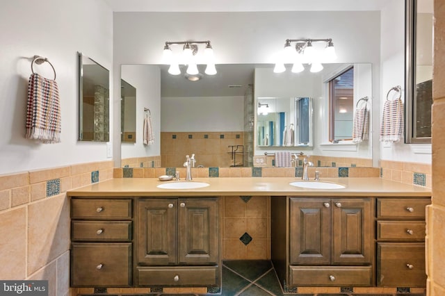 902 Emerald Dr, Alexandria, VA 22308 - bathroom featuring double vanity and tile walls