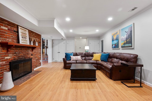 902 Emerald Dr, Alexandria, VA 22308 - living area featuring wood finished floors, ornamental molding, recessed lighting, baseboards, and a fireplace