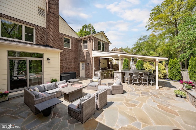 902 Emerald Dr, Alexandria, VA 22308 - view of patio / terrace with an outdoor living space with a fire pit and exterior kitchen
