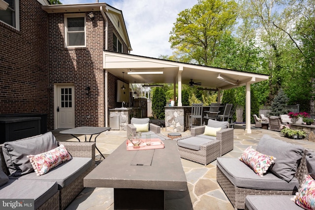 902 Emerald Dr, Alexandria, VA 22308 - view of patio with outdoor lounge area, a ceiling fan, and exterior kitchen