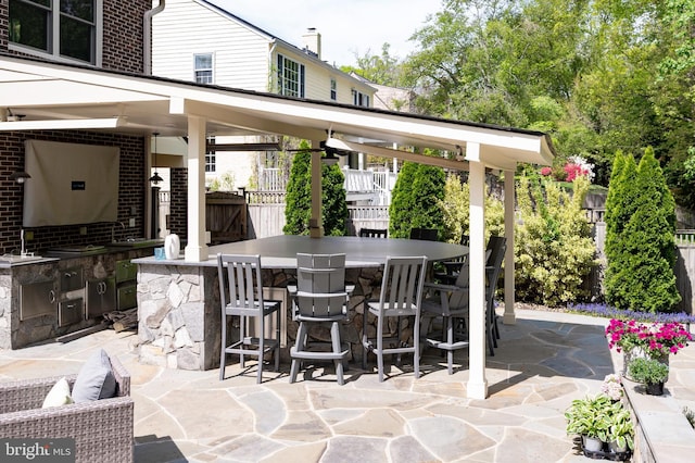 902 Emerald Dr, Alexandria, VA 22308 - view of patio / terrace featuring fence, exterior bar, and an outdoor kitchen