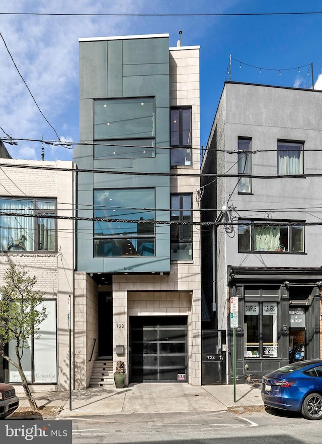 722 N 3rd St, Philadelphia, PA 19123 - view of building exterior featuring an attached garage
