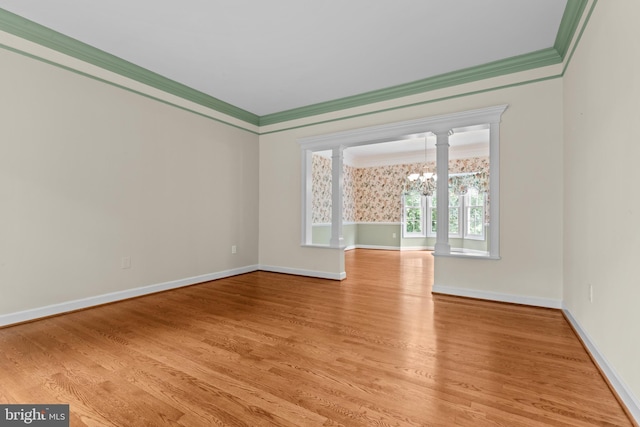 502 Pride Of Baltimore Dr, Arnold, MD 21012 - empty room featuring a chandelier, ornamental molding, wood finished floors, and baseboards