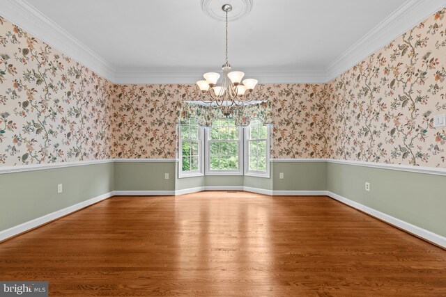 502 Pride Of Baltimore Dr, Arnold, MD 21012 - empty room featuring wood finished floors, a chandelier, ornamental molding, wallpapered walls, and baseboards